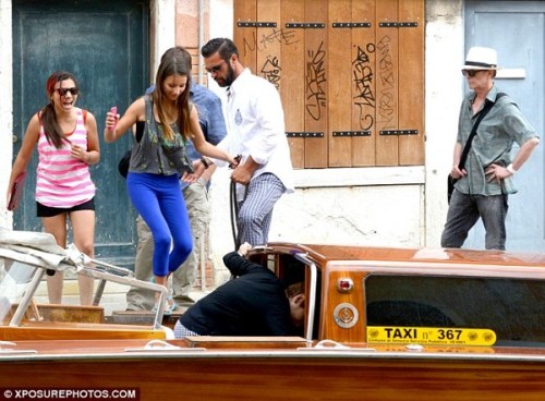 The Bowies’ day out: beaming from ear-to-ear, Lexi and friend climb aboard a water taxi in Venice yesterday