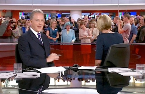 1 – Live on the BBC’s rolling news channel: anchor Sophie Long has already noticed HMQ photobombing their bulletin as the Queen tours the newsroom at New Broadcasting House